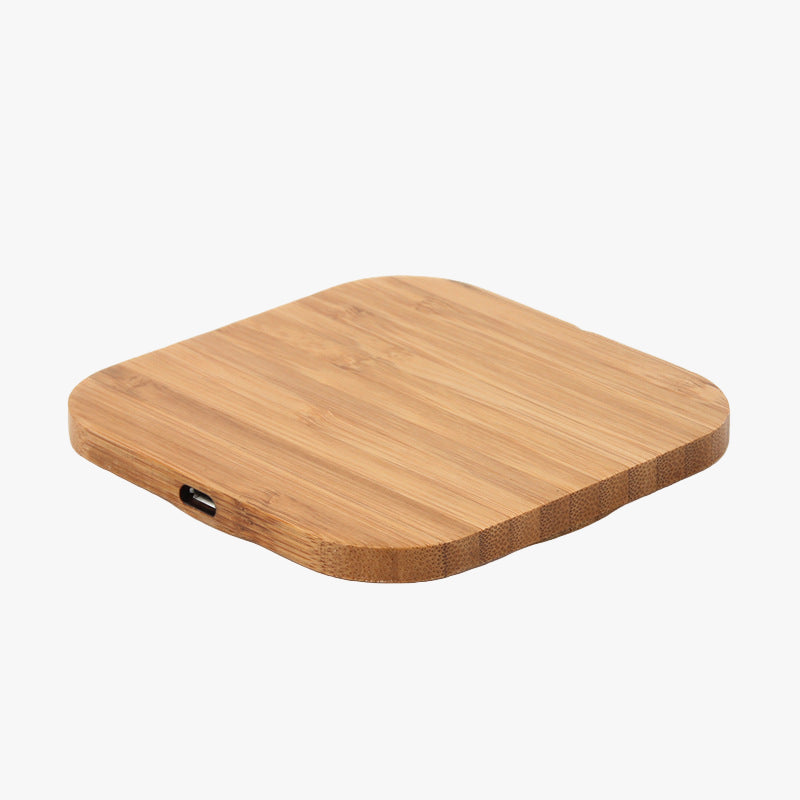 Wooden wireless charging pad on a white background