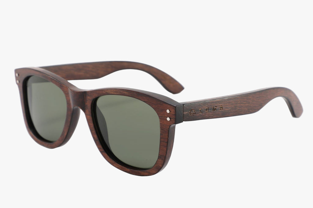 Wooden sunglasses with dark lenses on a white background
