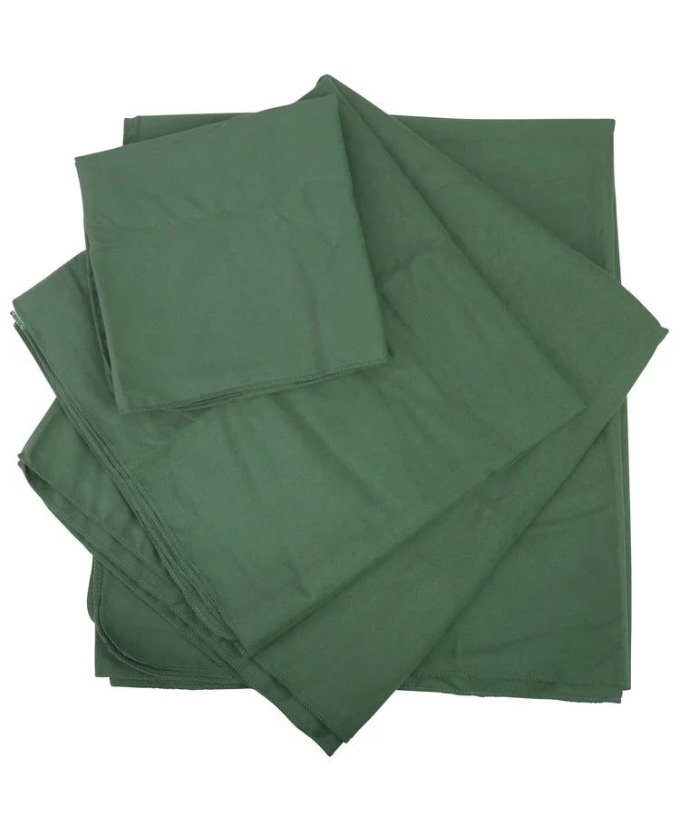 Green fabric sheets stacked on a white background