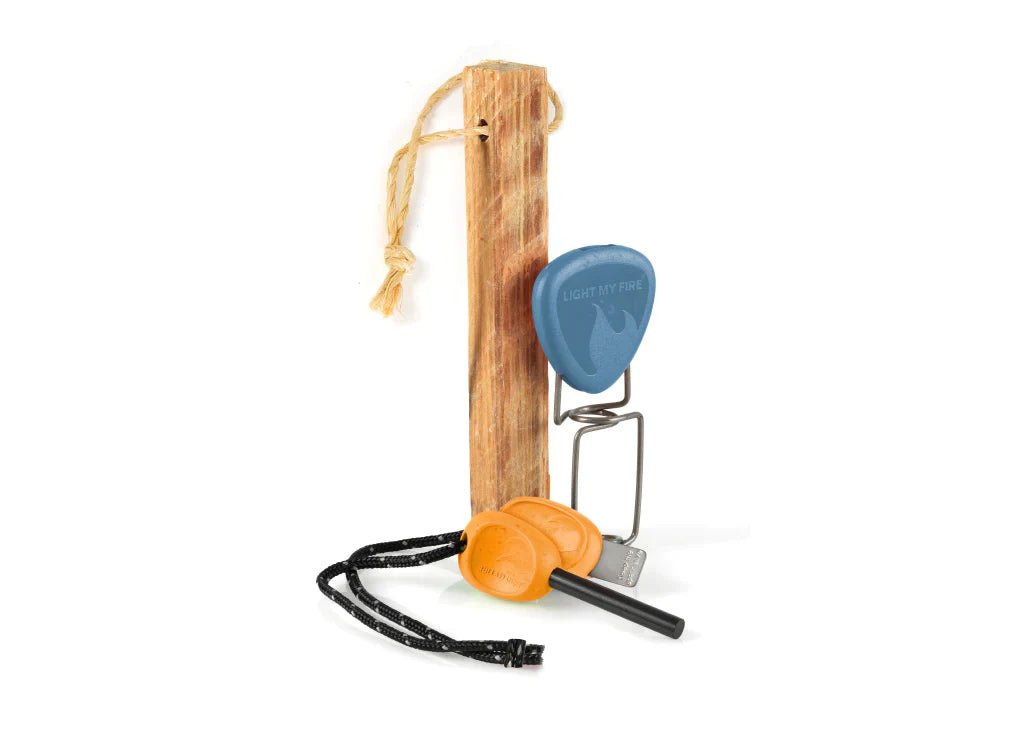 Fire starting tools including a wooden striker, orange flint, and metal striker on a white background