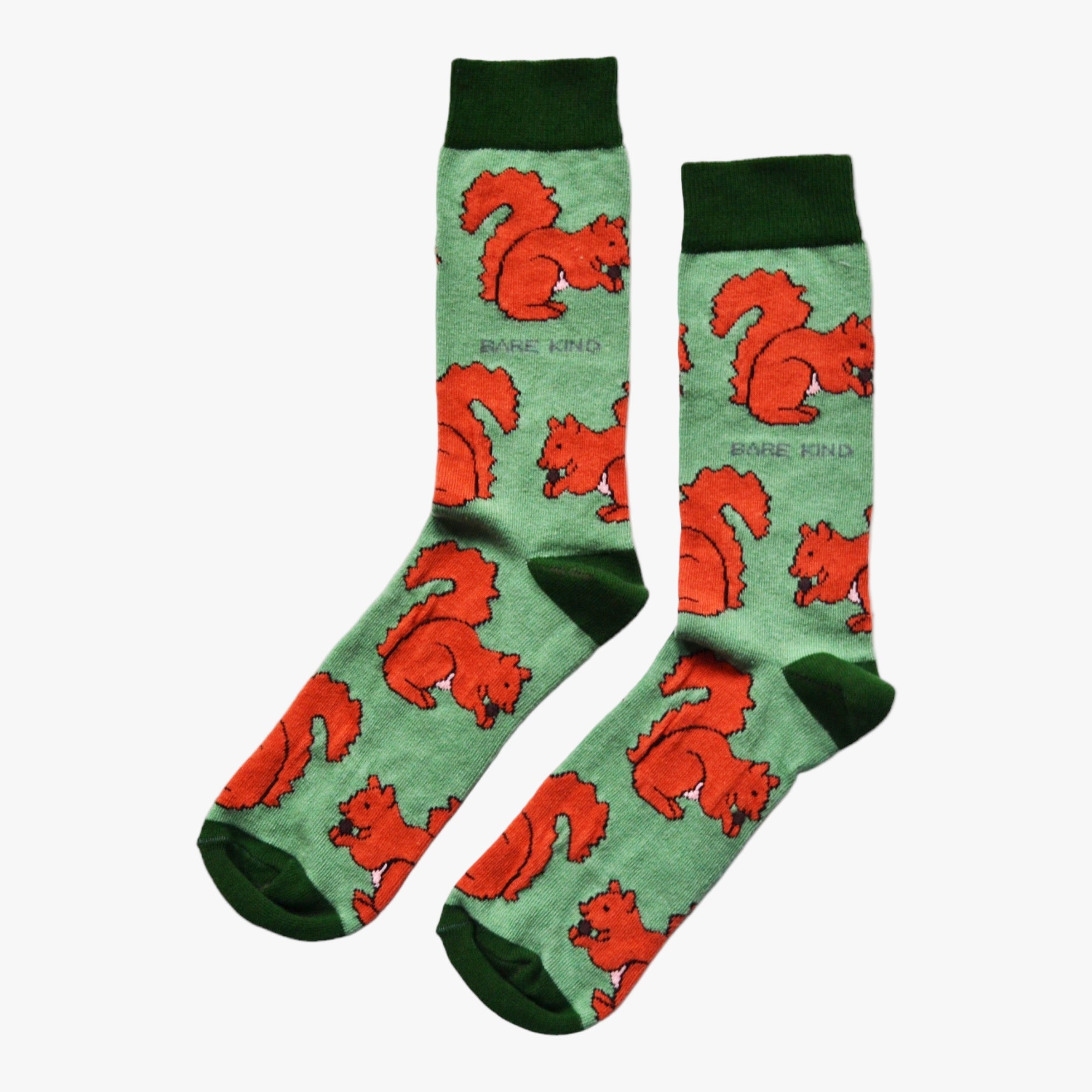 Green socks with red squirrel pattern on a white background.