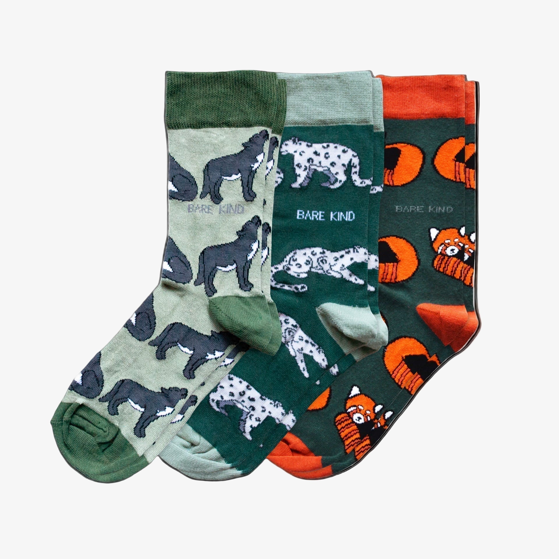Three pairs of socks with animal patterns on a white background